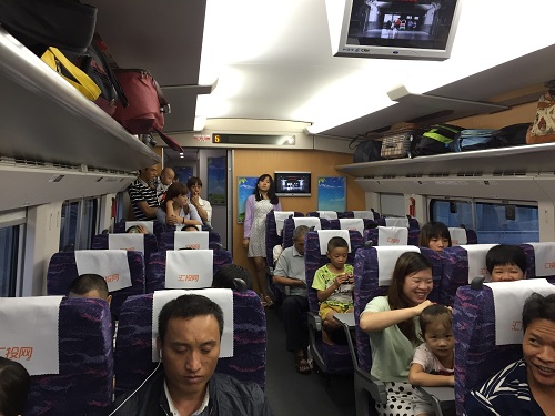Crowed hard seat carriage during the travel rush